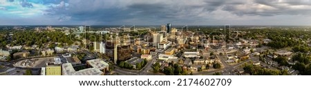 Aerial panorama of downtown Lexington, KY during early morning sunrise. Local University of Kentucky visible in a distance.
