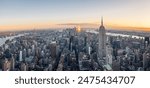 Aerial panorama of the Empire State Building and downtown Manhattan at dusk, New York City.