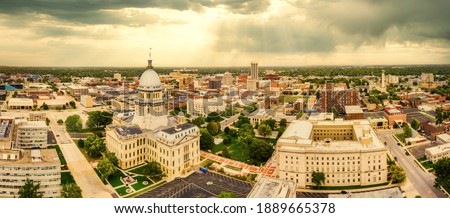Aerial panorama of the Illinois State Capitol and Springfield skyline under a dramatic sunset. Springfield is the capital of the U.S. state of Illinois and the county seat of Sangamon County