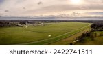 Aerial panorama landscape directly above York Racecourse showing the whole horse racing circuit with grandstand and buildings in the famous Yorkshire city