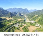 Aerial Panorama of Lush Laos Valley with River and Karst Mountains