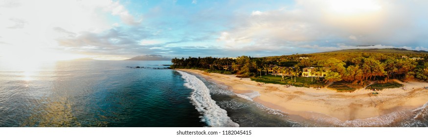 Aerial panorama of Maui beach at sunset.