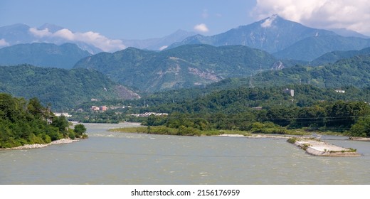 Aerial panorama of the mountain river and Dujiangyan Irrigation System from above, Dujiangyan, Sichuan, China 