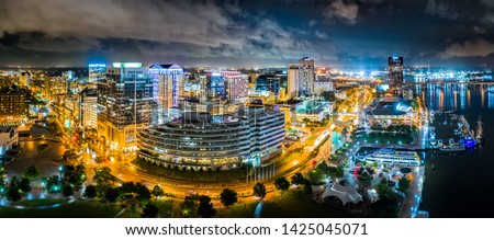 Aerial panorama of Norfolk Virginia by night. Norfolk is the second-most populous city in Virginia after neighboring Virginia Beach and the host of the largest navy base in the world.