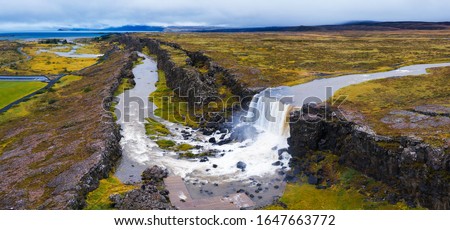 Aerial panorama of the Oxarafoss waterfalls in Iceland. Oxarafoss also called Oxararfoss is located in the Thingvellir National Park on the Oxara River.