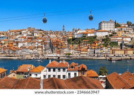 Aerial panorama of Porto with steep cable railway and the medieval Ribeira (riverside) district, narrow cobbled streets wind past merchants’ houses and cafes