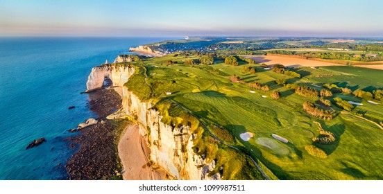 Aerial panorama of seaside with chalk cliffs at Etretat - Normandy, France - Shutterstock ID 1099987511