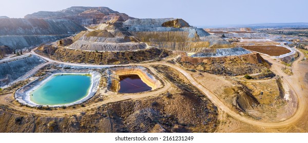 Aerial panorama of Skouriotissa copper mine in Cyprus with ore piles and multicolored pools - Shutterstock ID 2161231249