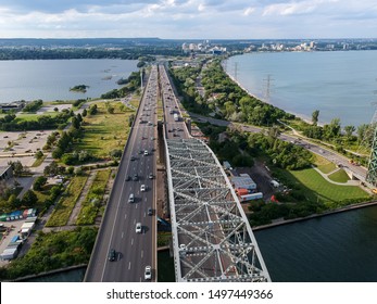 Aerial panorama of a Skyway Bridge connecting Burlington and Hamilton, Ontario, Canada. City infrastructure, civil engineering and planning concept.