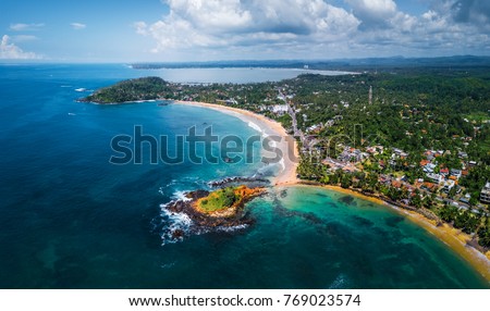Aerial panorama of the tropical beach in the town of Mirissa, Sri Lanka