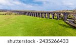 An aerial panorama view along the spectacular Harringworth Viaduct on a bright winter day