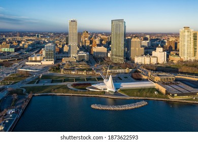 Aerial panorama view of Downtown Milwaukee at sunrise. Tall downtown buildings by the lake