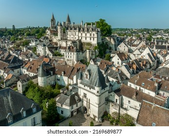 Aerial panorama view of Loches in Indre-et-Loire in the Loire Valley in France with massive Norman keep with double enclosure, semi circular towers, Renaissance palace, multiple medieval gates 