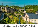 Aerial panorama view of Luxembourg-City lower town with park and Neumünster abbey