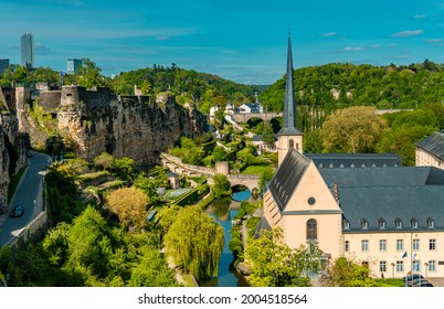 Aerial panorama view of Luxembourg-City lower town with park and Neumünster abbey