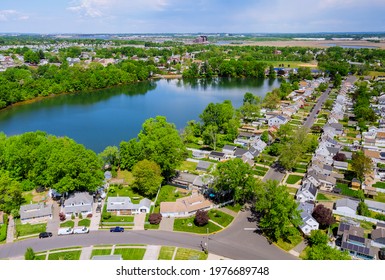 Aerial panorama view of the residential Sayreville town area of beautiful suburb of dwelling home near lake from a height in New Jersey USA
