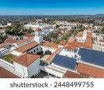 Aerial panorama view of San Diego State University, accredited public higher education institution with centennial plaza, aztec student union, health and human sciences college, love library, 