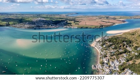Aerial panorama view of the town and beach of Padstow from Rock on The Camel Estuary in Cornwall, UK which is a popular vacation destination on a sunny Summer day