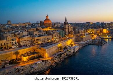 Aerial Panorama View Of Valletta Skyline, Evening, Night. Malta 