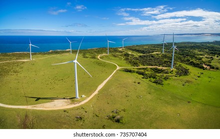 Aerial panorama of wind farm in rural area on bright sunny day in Australia