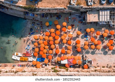 Aerial panoramic beach view in Polignano a Mare town, Puglia region, Italy near Bari city, Europe. Turquoise blue water of Adriatic sea. Traveling concept background.