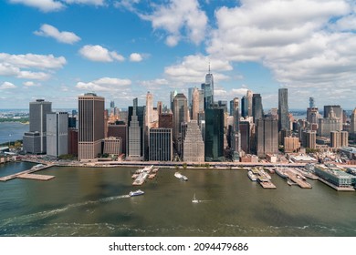 Aerial Panoramic City View Of Lower Manhattan Area Over East River, New York City, USA. Bird's Eye View From Helicopter Of Metropolis Cityscape. A Vibrant Business Neighborhood.