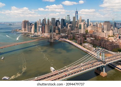 Aerial Panoramic City View OfLower Manhattan Area. Brooklyn And Manhattan Bridges Over East River, New York City, USA. Bird's Eye View From Helicopter Of Metropolis Cityscape. A Business Neighborhood.