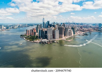 Aerial Panoramic City View On Lower Manhattan District And Financial Downtown, New York City, USA. Bird's Eye View From Helicopter. A Vibrant Business Neighborhood. Hudson River And East River.