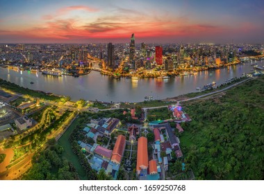 Aerial Panoramic Cityscape View Of HoChiMinh City And The River Saigon, Vietnam With Blue Sky At Sunset. Financial And Business Centers In Developed Vietnam