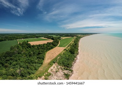 Aerial Panoramic Drone Sea Scape Photo Of Lake Erie Turquoise Water And White Clay Bluffs And High Cliffs With Blue Sky On A Sunny Summer Day. Ontario, Canada.