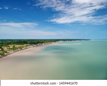 Aerial Panoramic Drone Sea Scape Photo Of Lake Erie Turquoise Water And White Clay Bluffs And High Cliffs With Blue Sky On A Sunny Summer Day. Ontario, Canada.