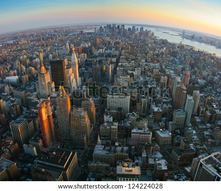 Aerial panoramic fish-eye view over lower Manhattan, New York from Empire State building top at sunset