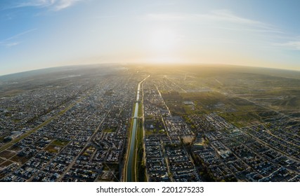 Aerial Panoramic Of General Roca Waterway On Amazing Sunny Sunset In Spring Time. Rio Negro, Patagonia, Argentina