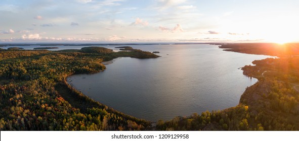 Aerial panoramic landscape view of a beautiful bay on the Great Lakes, Lake Huron, during a vibrant sunset. Located Northwest from Toronto, Ontario, Canada.