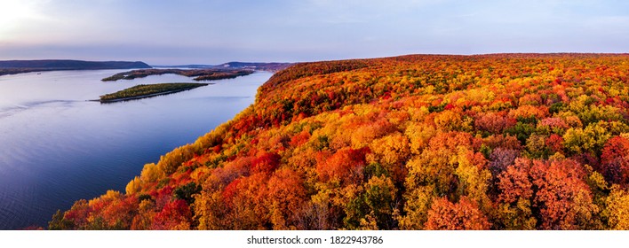 Aerial panoramic landscape view on Volga river with small sand islands and colorful forest on hills during autumn sunset, Samara, Russia - Shutterstock ID 1822943786