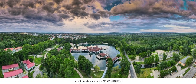 Aerial Panoramic Shot Of Lake Hévíz From Above, Lake Bath With Park And Forest.