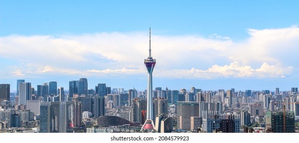 Aerial panoramic skyline view of Chengdu, a mega city in southwest China - Television Tower soars into the blue sky above vast city high rise buildings, construction in the foreground