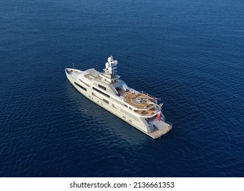 Aerial Panoramic Top Down Drone Photo Of A Super Yacht Anchored In Deep Blue Water In The Mediterranean Sea In Greece