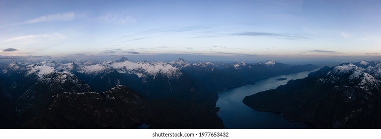 Aerial Panoramic View from Airplane of Canadian Mountain Landscape. Colorful Spring Sunset. Pitt Lake near Vancouver, British Columbia, Canada. Nature Backgrorund Panorama
