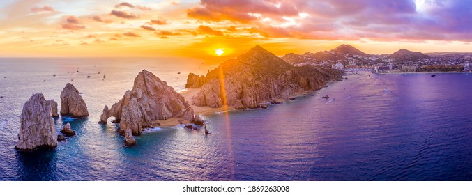 Aerial panoramic view of the Cabo San Lucas, Mexico marina and the rock formations at Lands End. the southernmost tip of the Baja California peninsula, where the Sea of Cortez meets the Pacific Ocean