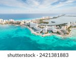 Aerial panoramic view of Cancun beach and city hotel zone in Mexico. Caribbean coast landscape of Mexican resort with beach Playa Caracol and Kukulcan road. Riviera Maya in Quintana roo region on