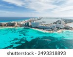 Aerial panoramic view of Cancun beach and city hotel zone in Mexico. Caribbean coast landscape of Mexican resort with beach Playa Caracol and Kukulcan road. Riviera Maya in Quintana roo region on