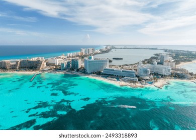 Aerial panoramic view of Cancun beach and city hotel zone in Mexico. Caribbean coast landscape of Mexican resort with beach Playa Caracol and Kukulcan road. Riviera Maya in Quintana roo region on