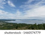 Aerial panoramic view of the city of Victoria from mount Douglas park with a beautiful Pacific Ocean scene.