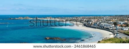 Aerial panoramic view of Cobo Bay, sandy beach landscape panorama in Guernsey, Channel Islands web banner