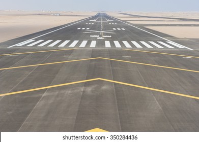 Aerial panoramic view of a commercial airport runway with connections and taxiways - Shutterstock ID 350284436