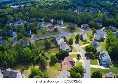 Aerial panoramic view of house cluster in a sub division in Suburbs  with golf course and lake in metro Atlanta in Georgia ,USA shot by drone shot during golden hour