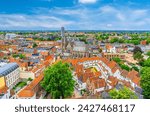 Aerial panoramic view of Kortrijk historical city centre with Roman Catholic Church of Our Lady, Courtrai Begijnhof and red tiled roof buildings, horizon amazing view, West Flanders province, Belgium