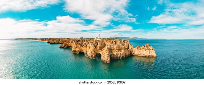 Aerial panoramic view of Lighthouse of Cabo De Sao Vicente or Cape of Saint Vincent located on high cliffs near Atlantic ocean