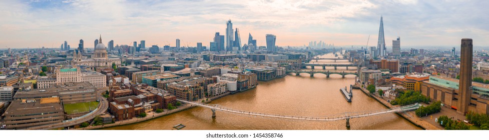 Aerial panoramic view of the London city district with many modern glass skyscrapers in the city center. United Kingdom.  - Shutterstock ID 1454358746